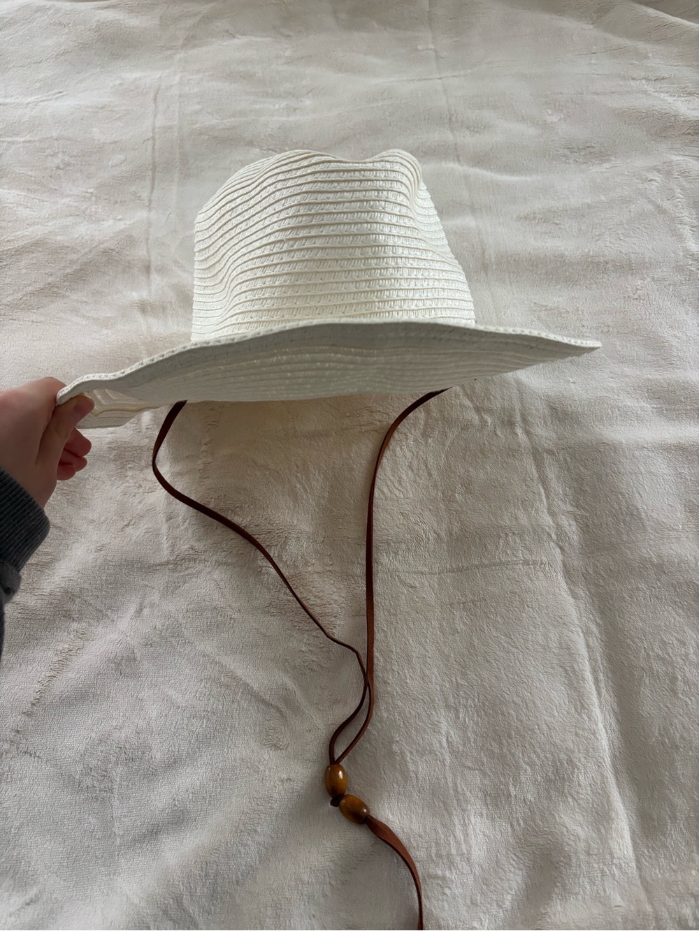 Cute white beach hat with brown leather strap